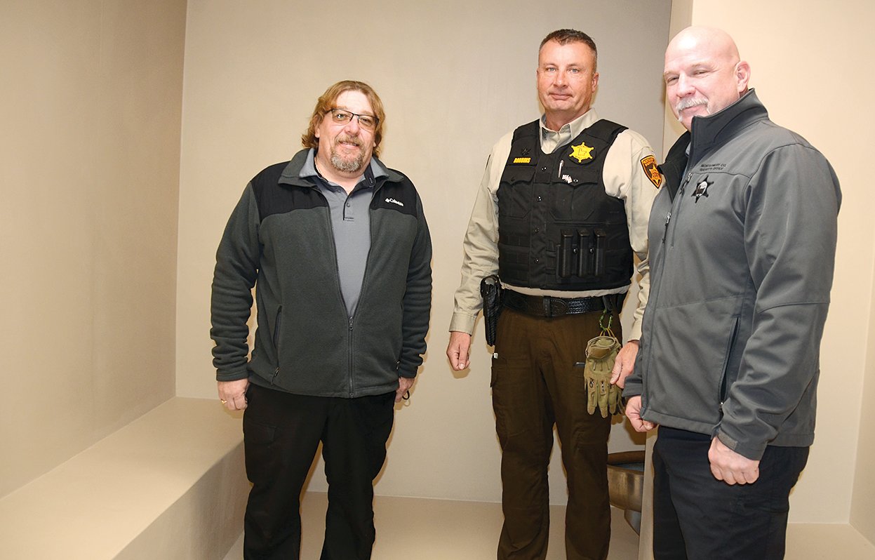 Pictured in the new padded cell at the Montgomery County Jail, from the left are 708 Board Chairman Danny Hough, Montgomery County Sheriff Rick Robbins and Captain Kevin Knisley.